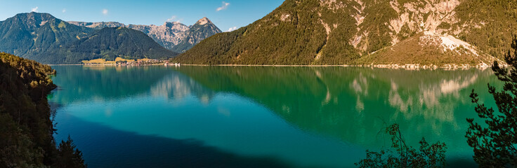 Naklejka na ściany i meble High resolution stitched panorama with reflections at the famous Achensee lake, Tyrol, Austria