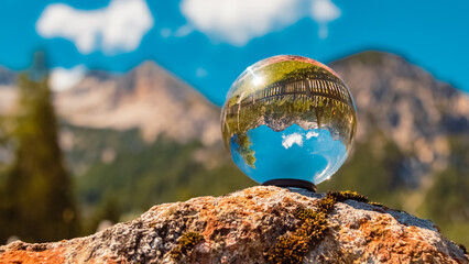 Crystal ball alpine landscape shot at the famous Gern Alm, Achensee, Tyrol, Austria