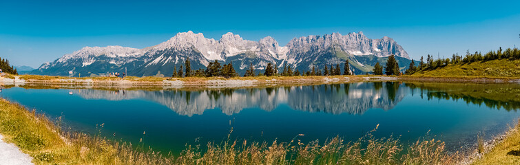 High resolution panorama with reflections in a lake at the famous Astberg summit, Going, Wilder Kaiser, Tyrol, Austria