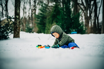 Fototapeta na wymiar child playing outside in winter