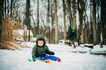 Fototapeta na wymiar child playing outside in winter