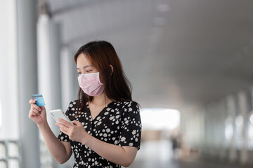 young adult asian woman with surgical face mask