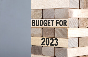The text on the wooden blocks BUDGET FOR 2023