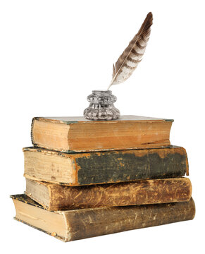 Stack of old books with glass inkwell and quill on top, cut out