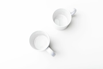 Closeup of a white mugs blended with the white background
