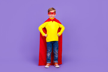 Full length photo of funny confident little grandson dressed red cape hands arms waist isolated purple color background