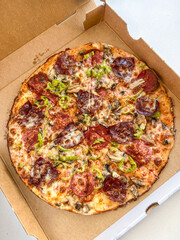 Italian pepperoni pizza in a box