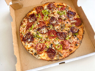 Italian pepperoni pizza with vegetables 