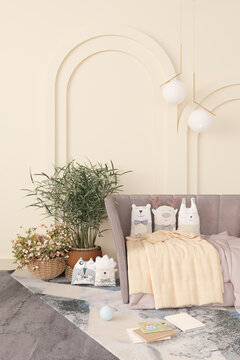 Minimal children room design, sofa with toys and plants in bright sand color interior background, 3d render