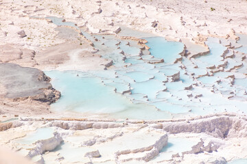 Emerald water in white limestone rock.