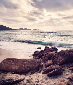 Cape Vilan Lighthouse from the Reira beach in Camari&ntilde;as, Galicia, Spain. This was the first electric lighthouse built on the Spanish coast at the end of the 19th century.
