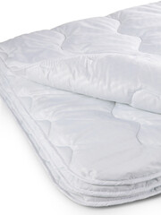 bed linen pillow and blanket made of quilted fabric with sewing and processing features