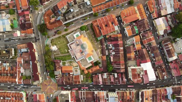 George Town, Malaysia: Aerial top down drone footage of the historic George Town UNESCO city center with the Kapitan Keling Mosque in Penang island. 