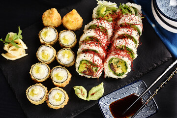 Top view of Japanese sushi set on black board