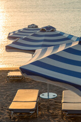Beach and Ocean with parasols and sunloungers in Faliraki, Rhodes, Greece