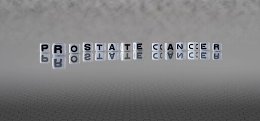prostate cancer word or concept represented by black and white letter cubes on a grey horizon...