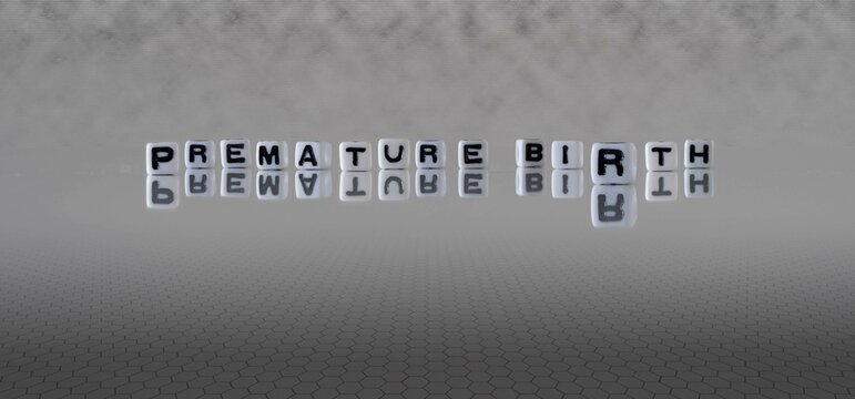 Premature Birth Word Or Concept Represented By Black And White Letter Cubes On A Grey Horizon Background Stretching To Infinity