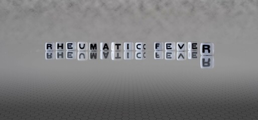 rheumatic fever word or concept represented by black and white letter cubes on a grey horizon...