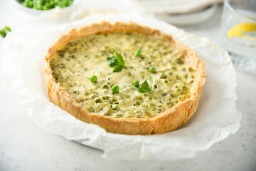 Homemade green pea quiche with cheese