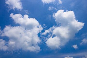Naklejka na ściany i meble Beautiful bright blue sky and clouds background