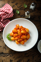 Traditional homemade potato gnocchi with tomato sauce