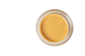 Mustard sauce in a glass bowl. Top view