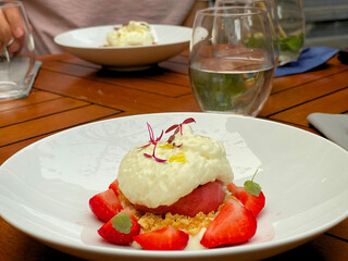 Close up of a culinary meal on a terrace served on a wooden table