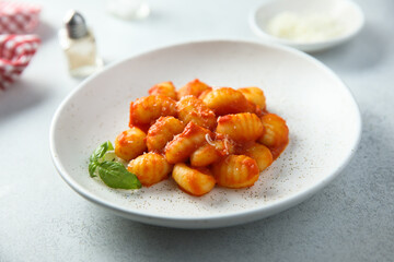 Traditional homemade potato gnocchi with tomato sauce