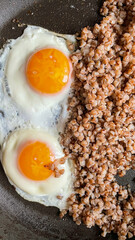 Eggs, buckwheat, tomatoes and spinach on a plate. Healthy breakfast.