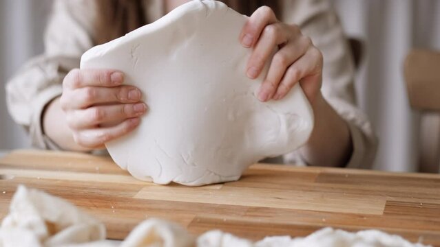Handcraft woman master modeling cold porcelain, hands pressure dough porcelain, Girl sculpts from porcelain, hobby for the soul scandinavian and boho style interior decor