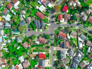 Deurstickers Panoramic Aerial Drone view of Suburban Melbourne housing, roof tops, the streets and the parks NSW Australia © Elias Bitar