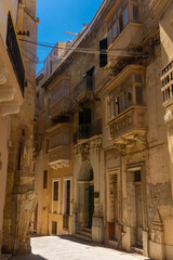 Fototapeta na wymiar View of an ancient street in Birgu old town, one of the Three Cities of Malta