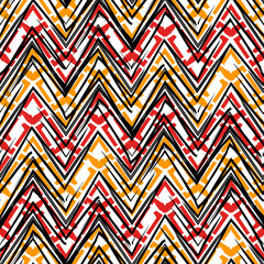 Ethnic seamless pattern. Freehand zigzag stripes print. Boho chic design background. Tribal wallpaper. Brush wavy lines. Handdrawn geometric ornament. Chevron backdrop. Indigenous image. Vector art.