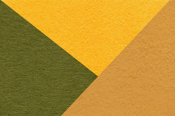 Texture of craft yellow, green and orange shade color paper background, macro. Vintage abstract...
