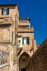 Fototapeta na wymiar Old medieval buildings in Siena city center, Tuscany, Italy