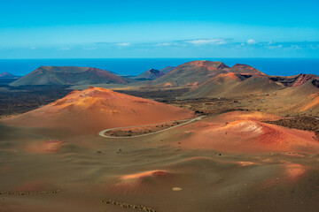Naklejka na ściany i meble The amazing volcanic landscape of Timanfaya National Park in Lanzarote, Canary Islands, Spain