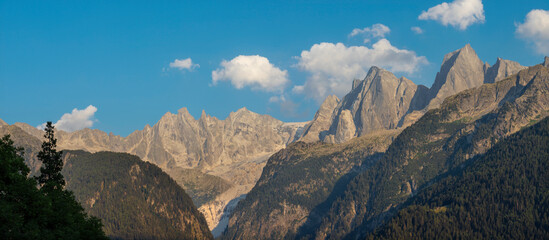 The Piz Badile, Pizzo Cengalo, and Sciora peaks in the Bregaglia range - Switzerland in evening light.