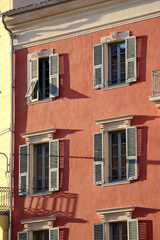 Fototapeta premium Typical facade in the south of France, on the French Riviera, windows with colored shutters