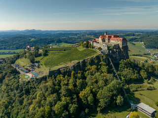 Fototapeta na wymiar Austria - The Riegersburg castle surrounded by a beautiful landscape Located in the region of Styria from drone view