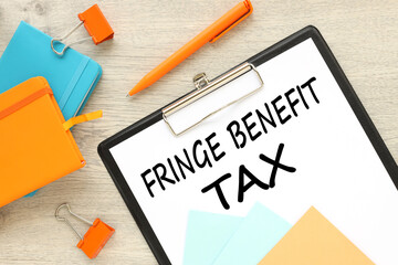 work desk text on paper on folder. FBT Fringe Benefit Tax