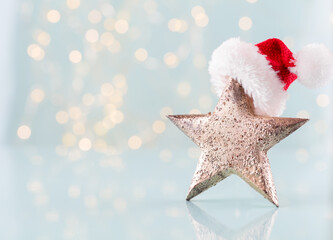 Christmas star with santa hat decor. Christmas star on bohek background.