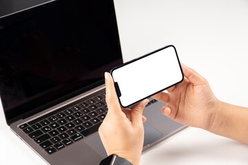 Modern phone mock up, office worker holding modern phone mock up. Close up over shoulder view of woman watching, looking, video calling, attending online meeting concept idea photo with copy space.