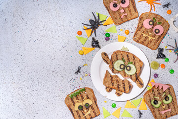 Funny halloween monster sandwiches. Set of various decorated monster sandwich and toasts, with...