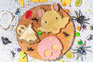 Funny halloween monster sandwiches. Set of various decorated symbols sandwich - bat, skull, ghost,...