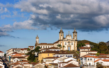 Fototapeta na wymiar Famous baroque churches with their towers among old houses in the city3 of Ouro Preto in Minas Geais