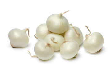 Heap of fresh raw pearl onions close up isolated on white background