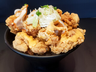Fried chicken with mayonnaise sauce and rice on dish background