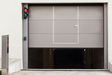 Garage Door to Car Parking. Automatic Entrance Gate to Underground Car Parking with Traffic light. 