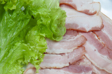 Delicious bacon on top of a white background