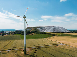 panorama of the countryside - potash landfill with wind energy plant